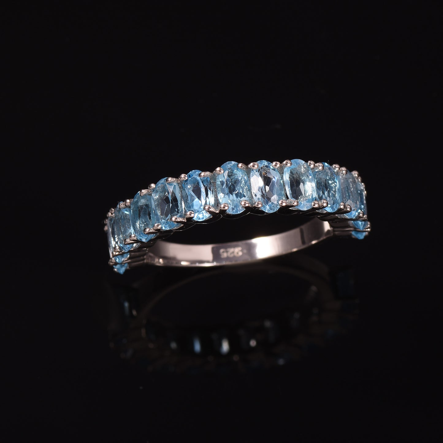 Oval Cut Blue Topaz Half Eternity Band