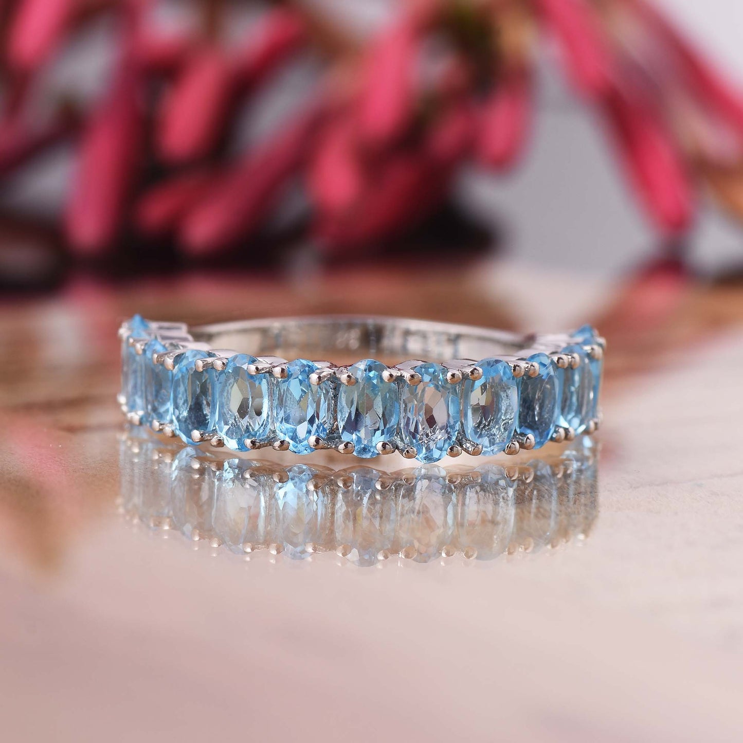 Oval Cut Blue Topaz Half Eternity Band