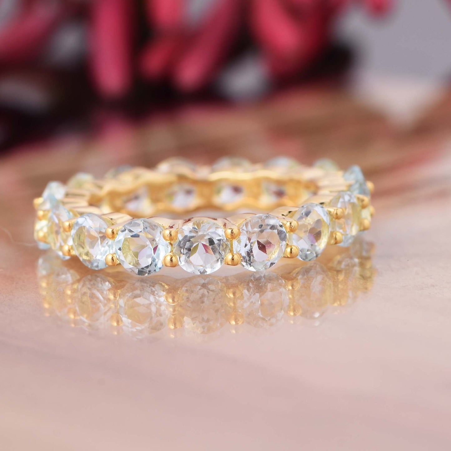 Round Aquamarine Eternity Band